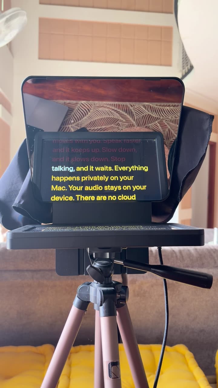OnScript running behind the glass of a teleprompter rig on a tripod